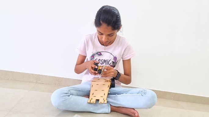 girl making diy car